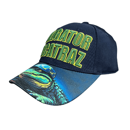 Alligator Alcatraz Navy Hat with bold green and yellow embroidery on a deep navy blue base, featuring a colorful illustration of an alligator on the bill.