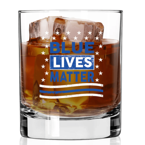 Blue Lives Matter Whiskey Glass featuring 'BLUE LIVES MATTER' design with stars and a thin blue line, displayed on a table ready for use.