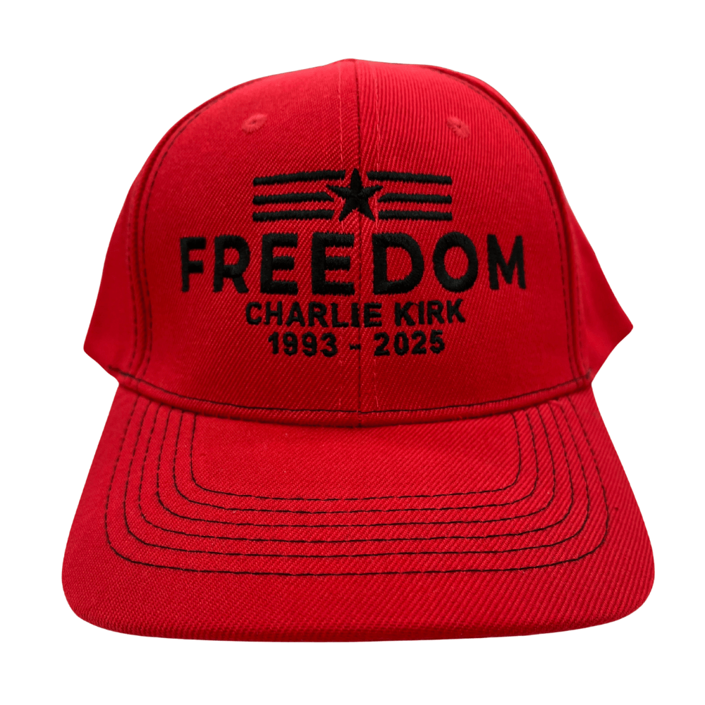 Charlie Kirk Freedom Star Red Hat featuring black embroidered 'FREEDOM' text and star-stripe emblem on a red cotton twill background.