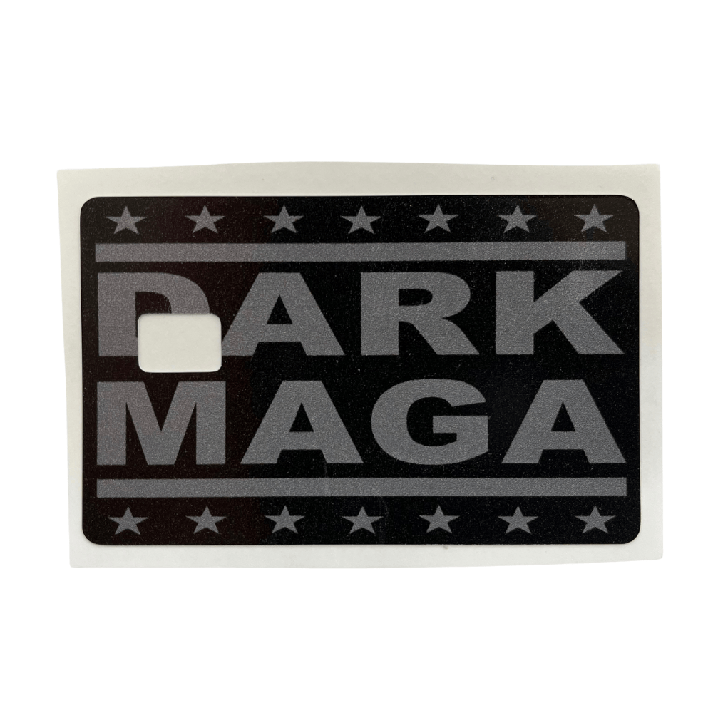 Dark MAGA credit card cover with a sleek black-and-gray design, featuring bold lettering and star patterns, displayed with credit cards.