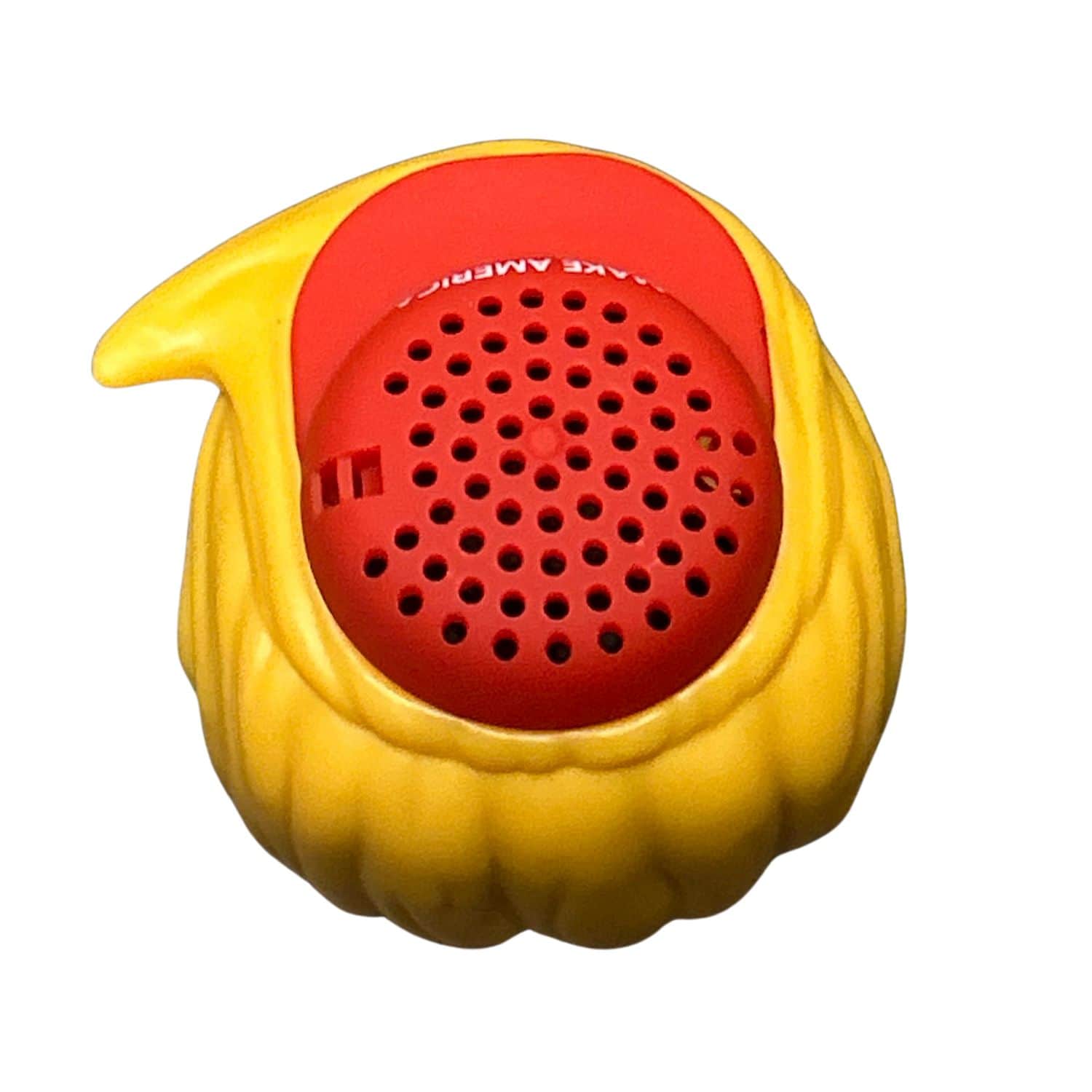 Donald Trump Wireless Bluetooth Speaker shaped like a cartoon Trump wearing a red MAGA hat, showcasing its fun design and compact size.
