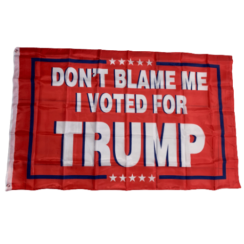 Don't Blame Me I Voted For Trump 3x5 flag with bold lettering on a vivid red background, displayed on an outdoor flagpole.
