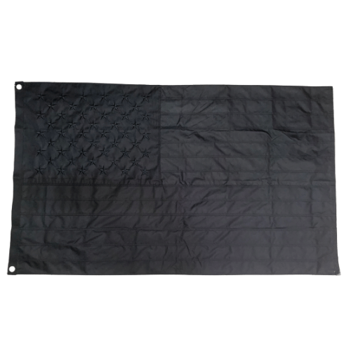 Double Sided Blacked Out American 3x5 Flag featuring an all-black design displayed prominently on a flagpole outdoors.
