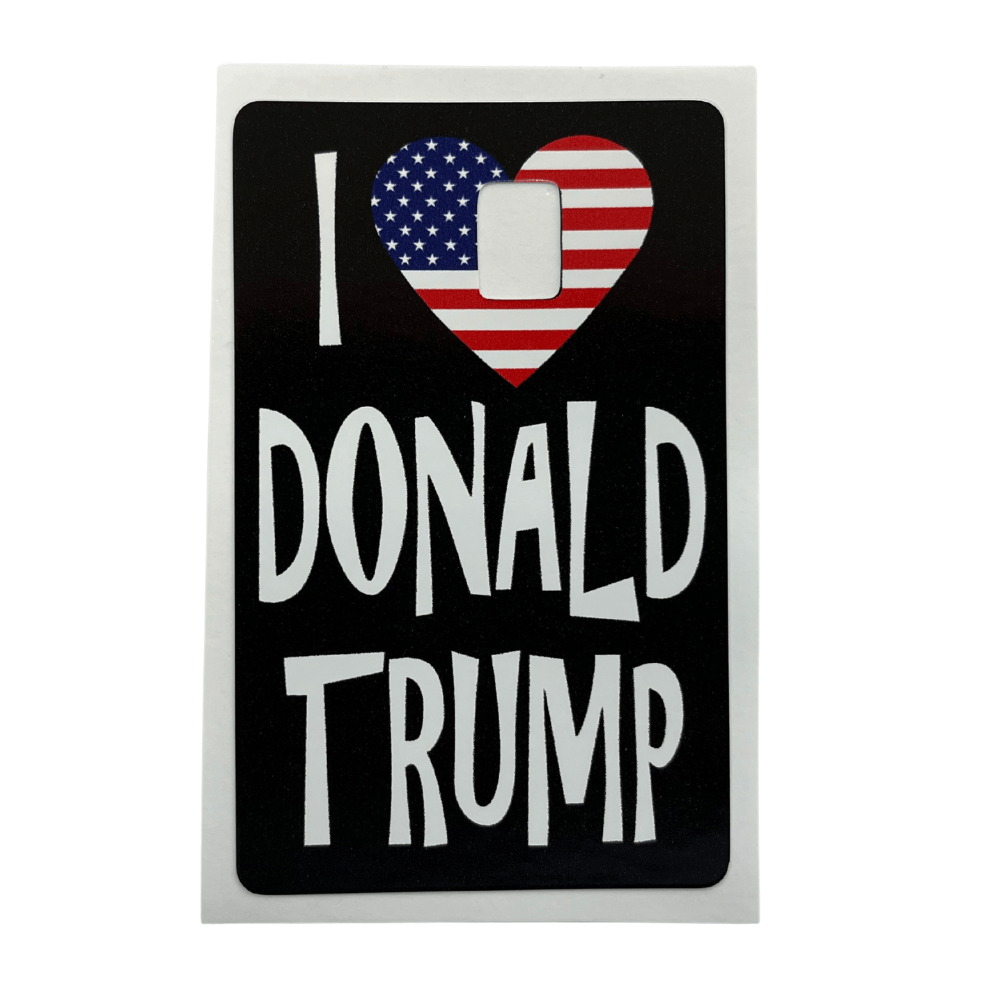 I Love Donald Trump credit card cover with striking white text and patriotic heart design against a sleek black background.