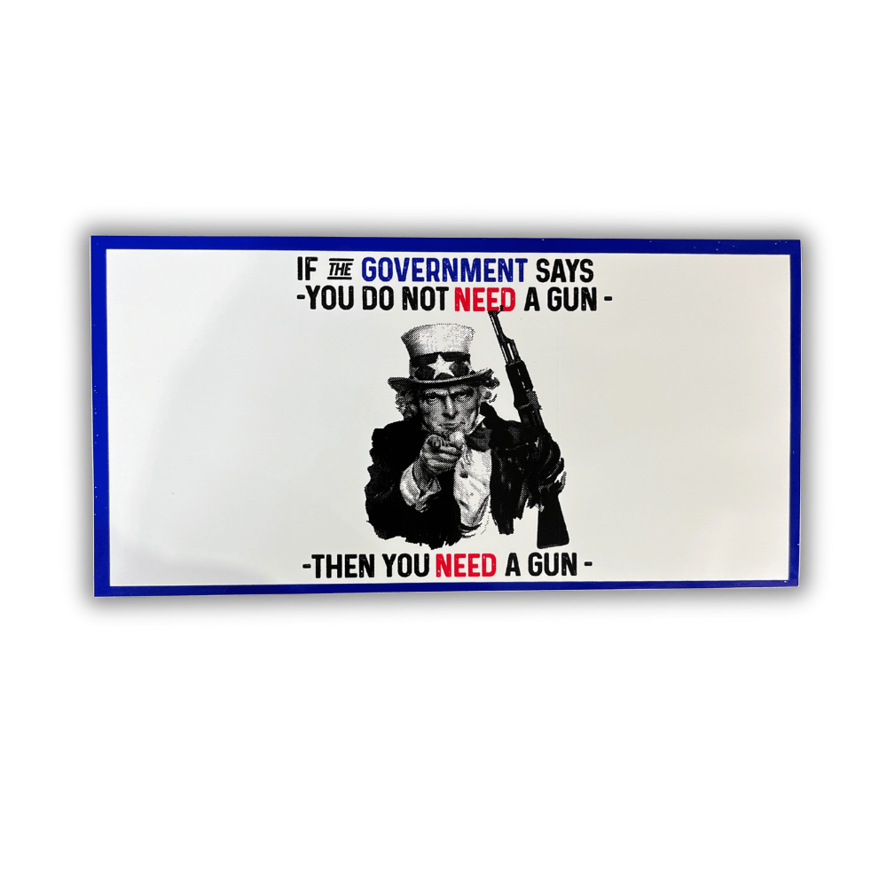 Need A Gun bumper sticker displayed on the rear bumper of a truck, showcasing bold design and vibrant colors against a clear background.