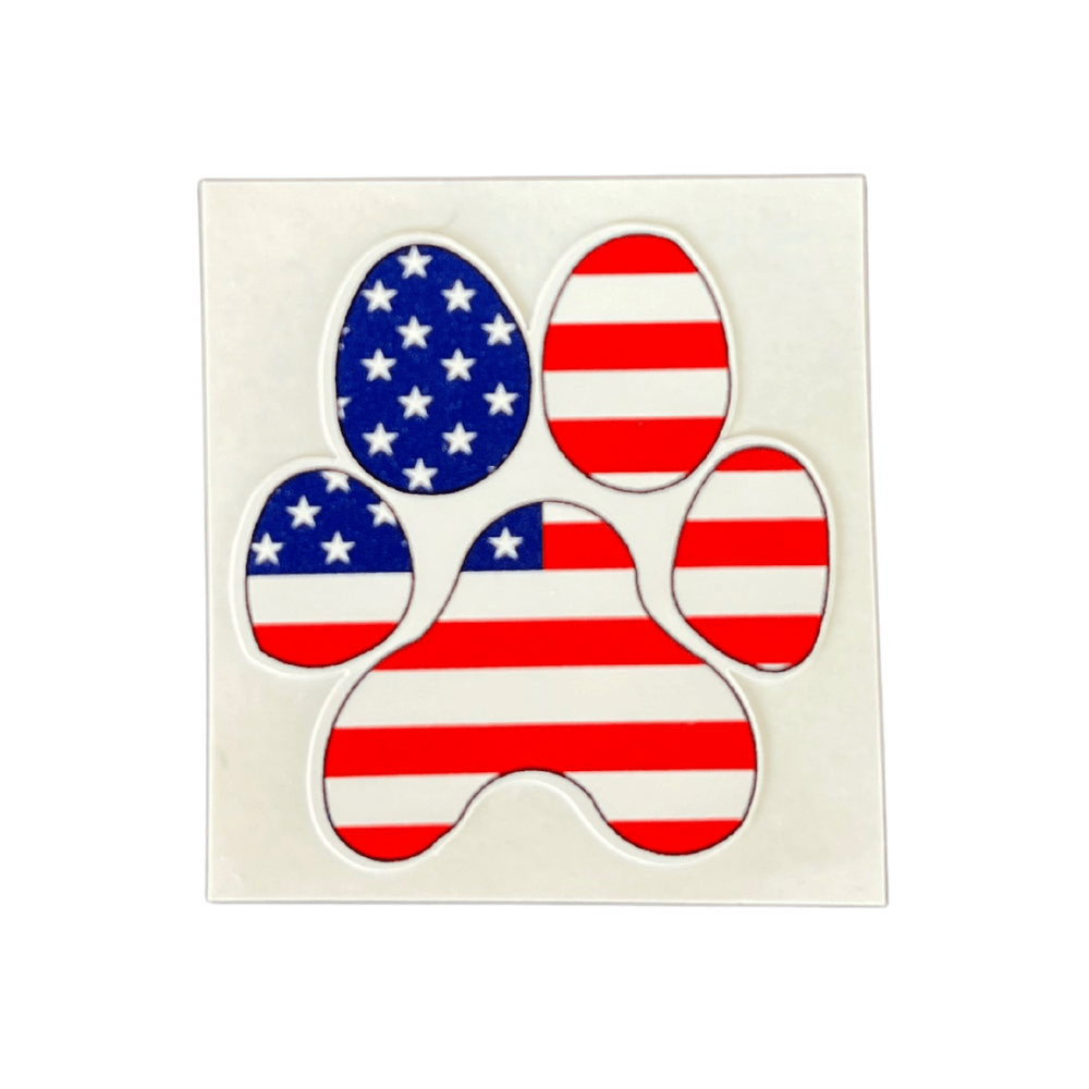 Patriotic Paw Print Sticker showcasing an American flag design on a smooth surface ideal for outdoor applications.