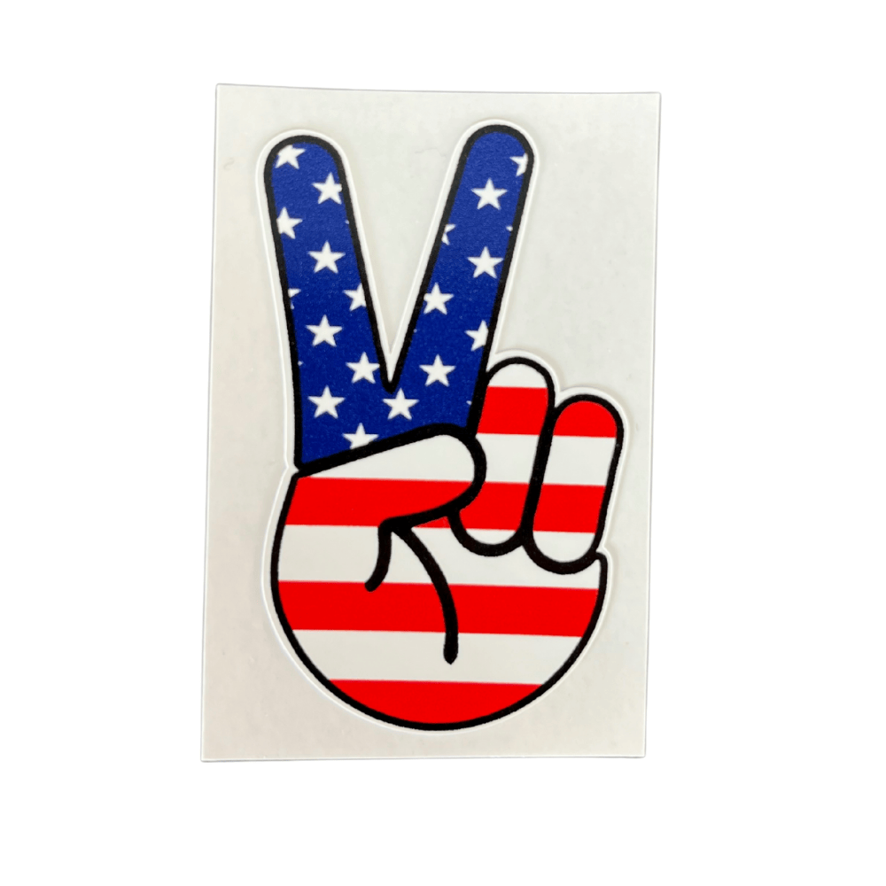 Patriotic Peace Fingers Sticker displayed on a laptop, featuring bold American-themed graphics in vibrant colors on durable vinyl.