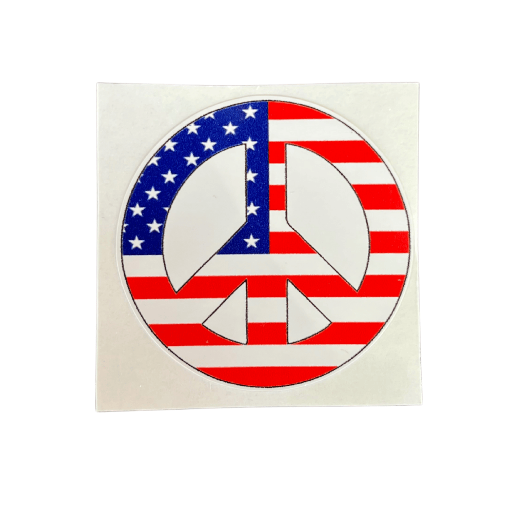 Patriotic Peace Sticker featuring bold American themes displayed on a laptop, highlighting its vibrant colors and durable design.