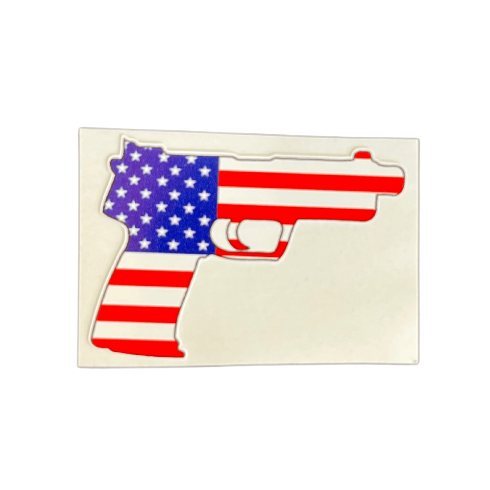 Vibrant Patriotic Pistol Sticker showing classic American themes, displayed on a smooth surface like a laptop or car window.