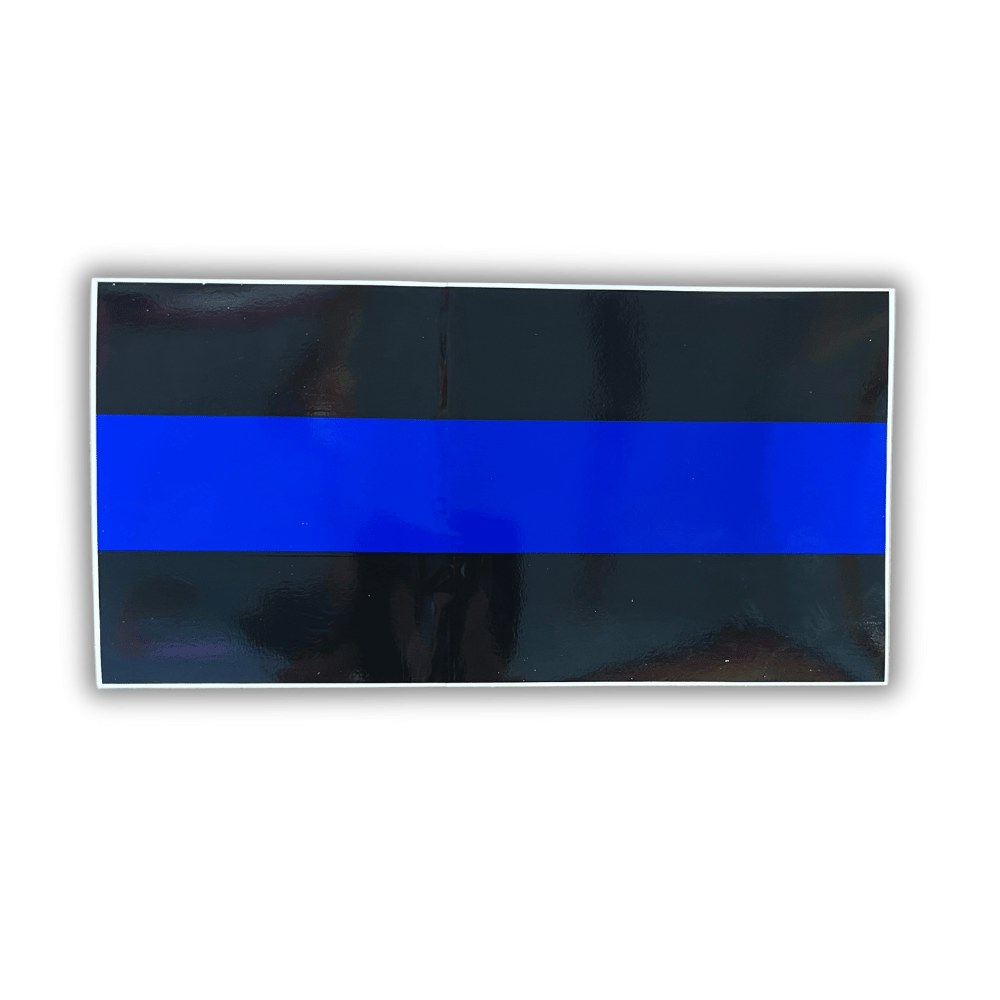 Thin Blue Line bumper sticker featuring bold black and blue design, displayed on a car bumper under natural light.