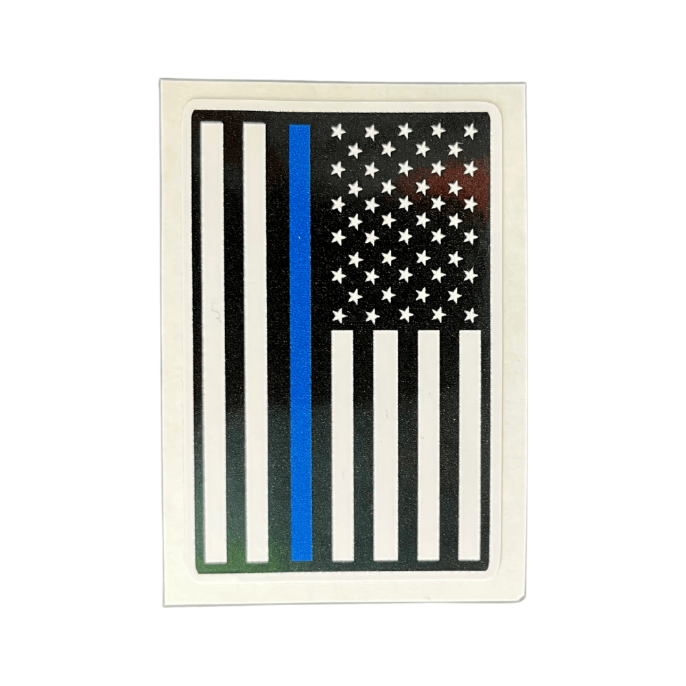 Thin Blue Line sticker featuring a blue line against the American flag design displayed on a car window, showcasing patriotic support.