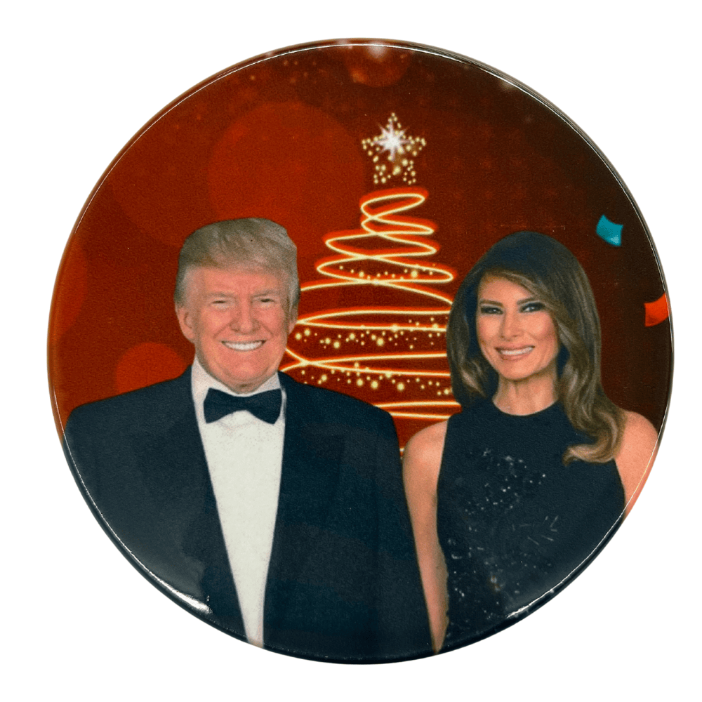 Trump & Melania Christmas ceramic coaster featuring the First Couple against a red background with a golden Christmas tree design.