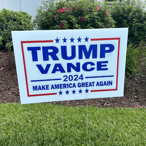 Trump Vance MAGA Campaign Yard Sign displaying vibrant graphics and bold messaging positioned in a residential yard setting.