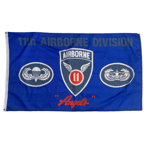 11th Airborne Division 3x5 Flag featuring emblem on a blue background, displayed outdoors with vibrant color and durability.