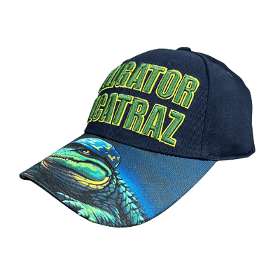 Alligator Alcatraz Navy Hat with bold green and yellow embroidery on a deep navy blue base, featuring a colorful illustration of an alligator on the bill.