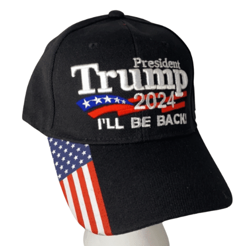 Black President Trump 2024 hat featuring 'I'll Be Back' message and American flag design on the bill, displayed outdoors in a casual setting.