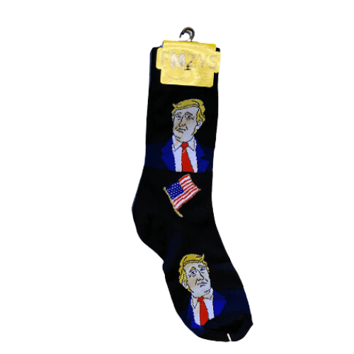 Black Trump Quarter Socks featuring President Trump's face and American flag design, displayed on a wooden surface.