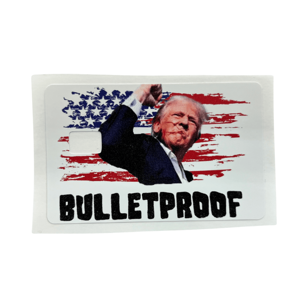 Bulletproof Trump Credit Card Cover featuring Trump raising fist in front of distressed American flag with rugged black lettering.