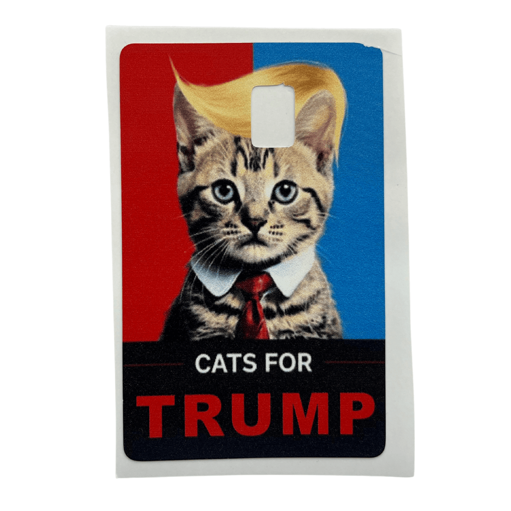 Cats for Trump credit card cover displaying a cat in a suit and tie with a swooped hairstyle on a vibrant red-and-blue background.