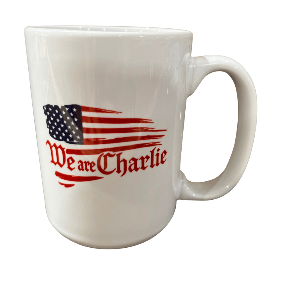 Charlie Kirk We Are Charlie 15oz Mug with brushed American flag design and red script, perfect for showcasing patriotism while enjoying beverages.