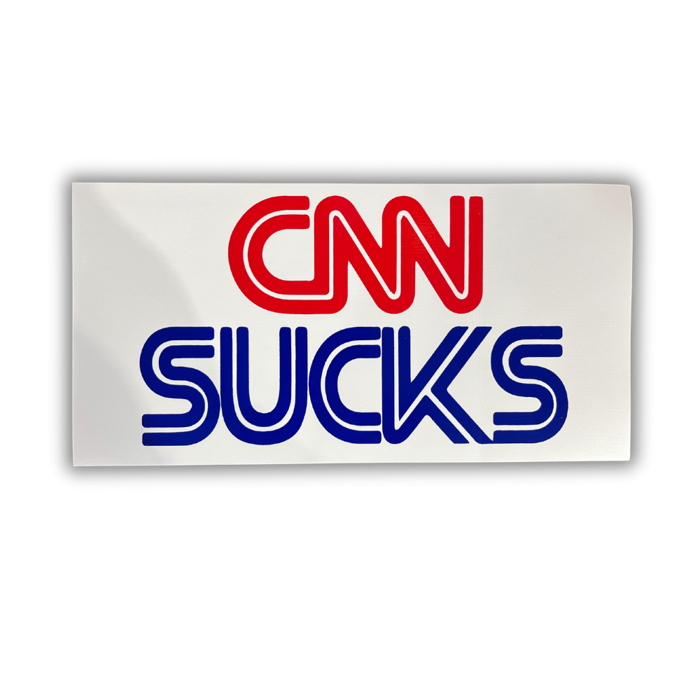 CNN Sucks bumper sticker made of premium outdoor-grade vinyl displayed on a vehicle bumper, featuring bold patriotic text.