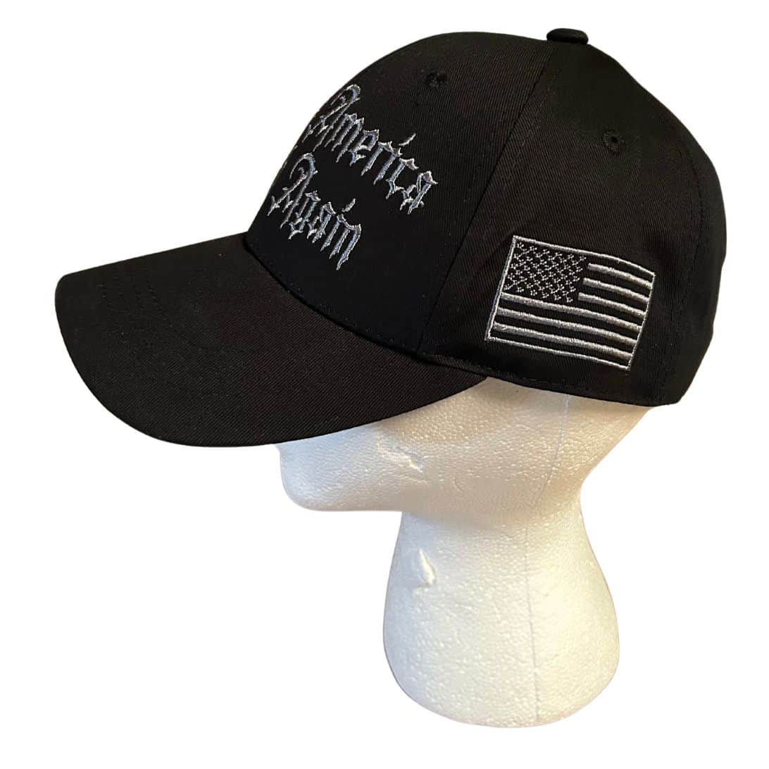 Dark MAGA Gothic Never Surrender Hat featuring gothic lettering on a grey-on-black background, perfect for bold political statements.