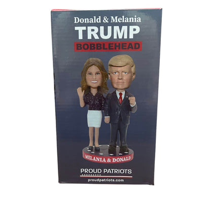 Donald & Melania Trump Bobblehead featuring the couple in signature outfits, displayed on a star-spangled base for patriotic appeal.