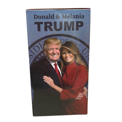 Donald & Melania Trump Bobblehead featuring the couple in signature outfits, displayed on a star-spangled base for patriotic appeal.