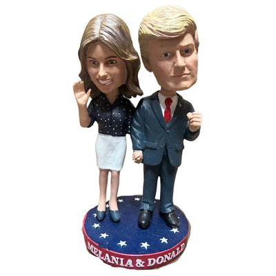 Donald & Melania Trump Bobblehead featuring the couple in signature outfits, displayed on a star-spangled base for patriotic appeal.