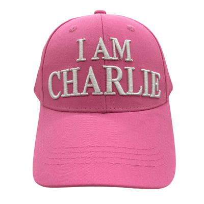 I Am Charlie Pink Hat featuring bold white embroidery, 'I AM CHARLIE' on the front and 'CHARLIE KIRK' on the back, displayed outdoors.
