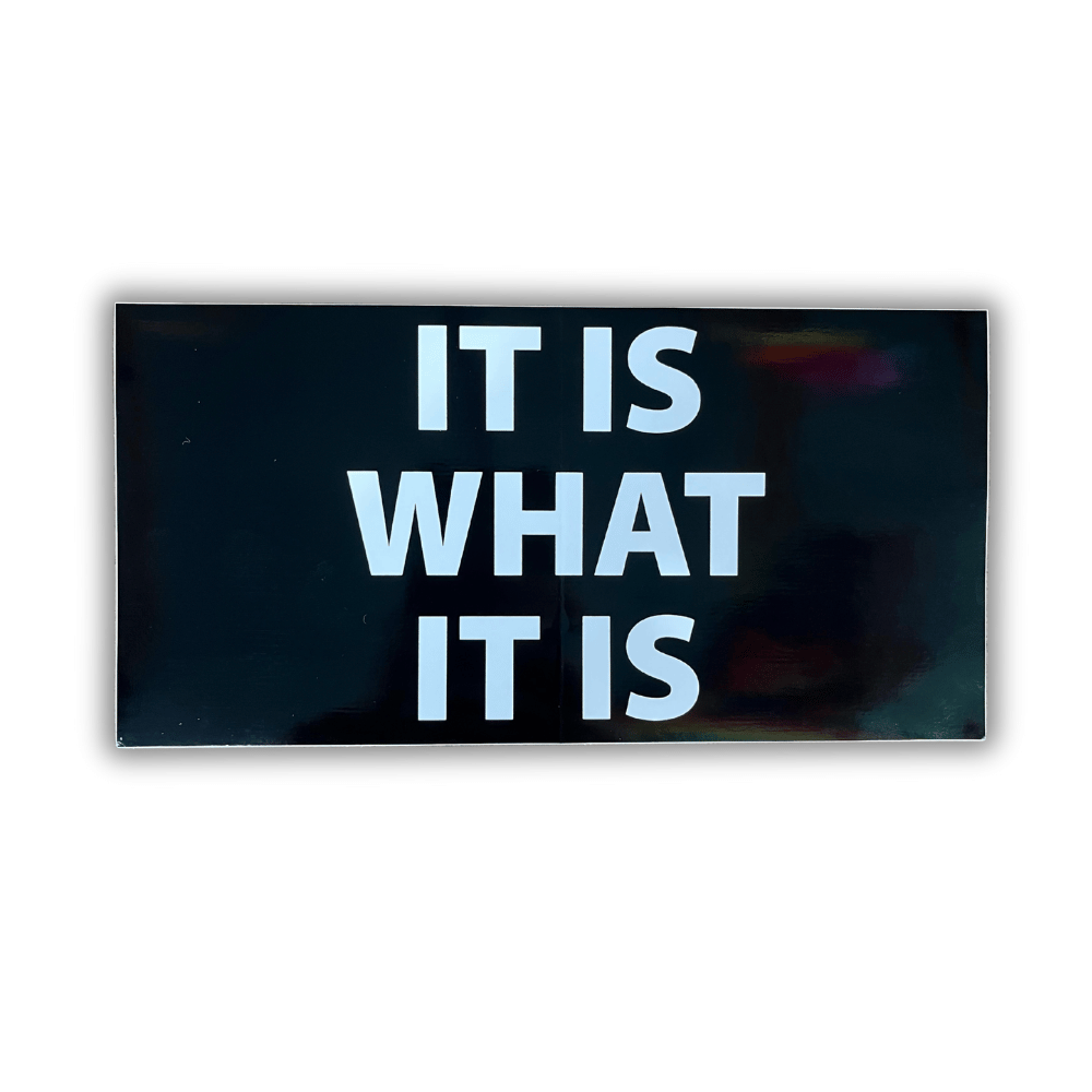 It Is What It Is Bumper Sticker showcasing bold patriotic colors and design, affixed securely on a car bumper for maximum visibility.