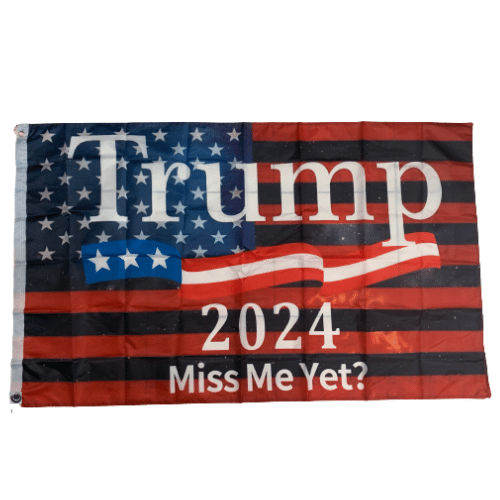 Miss Me Yet? Trump 2024 flag measuring 3x5 feet, featuring a bold design against the backdrop of the American flag, displayed outdoors.