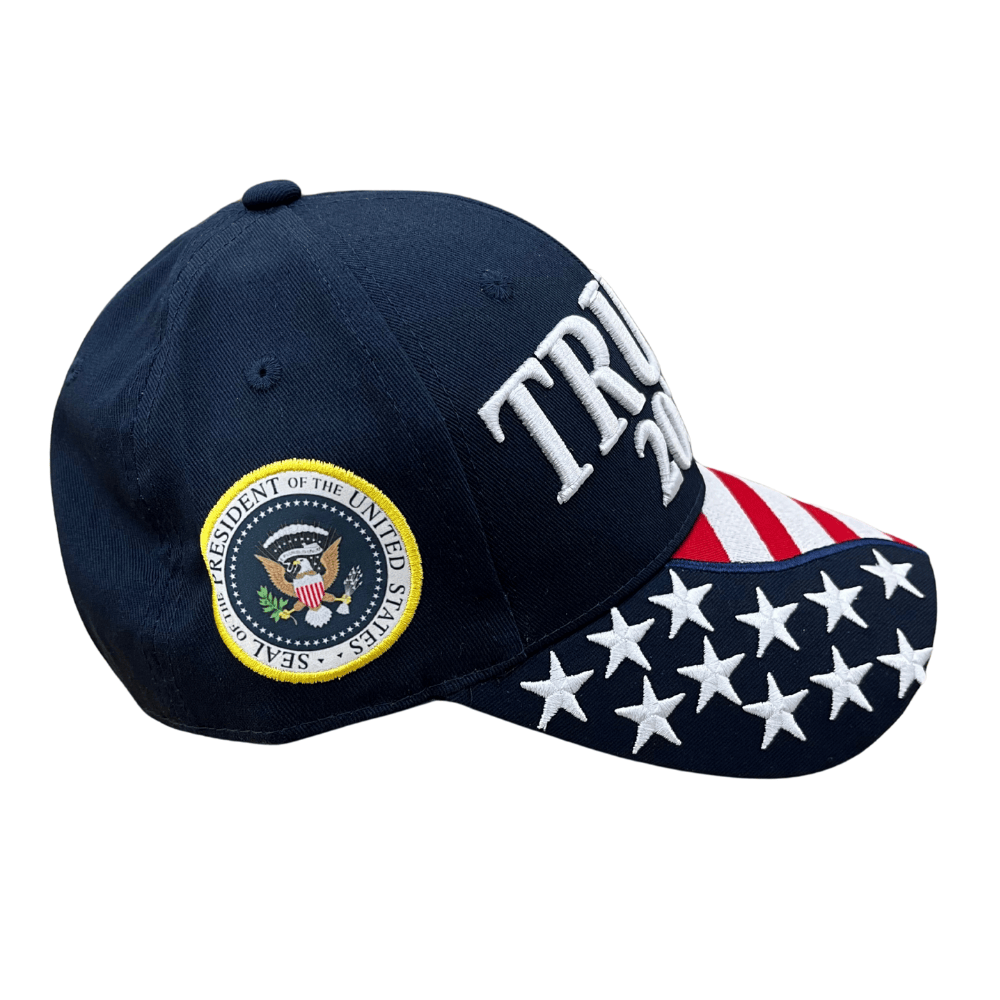 Navy Trump 2028 Patriotic Hat featuring 'TRUMP 2028' and an embroidered American flag displayed outdoors against a bright sky.