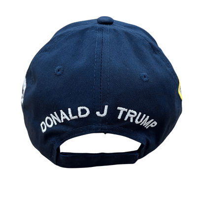 Navy Trump 2028 Signature Hat with tone-on-tone embroidery, U.S. flag, and Presidential Seal, displayed on a table against a neutral background.