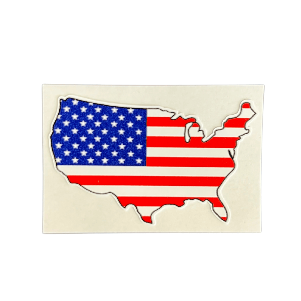 Patriotic USA Outline Sticker on a car window in a bright outdoor setting, showcasing its bold design and vibrant colors.
