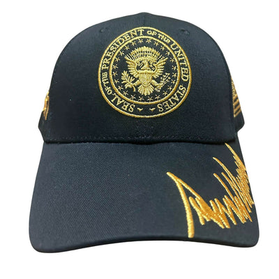 President Trump Signature & Seal 45/47 Gold Hat featuring black fabric, gold embroidered Presidential Seal and signature, and American flag detail.