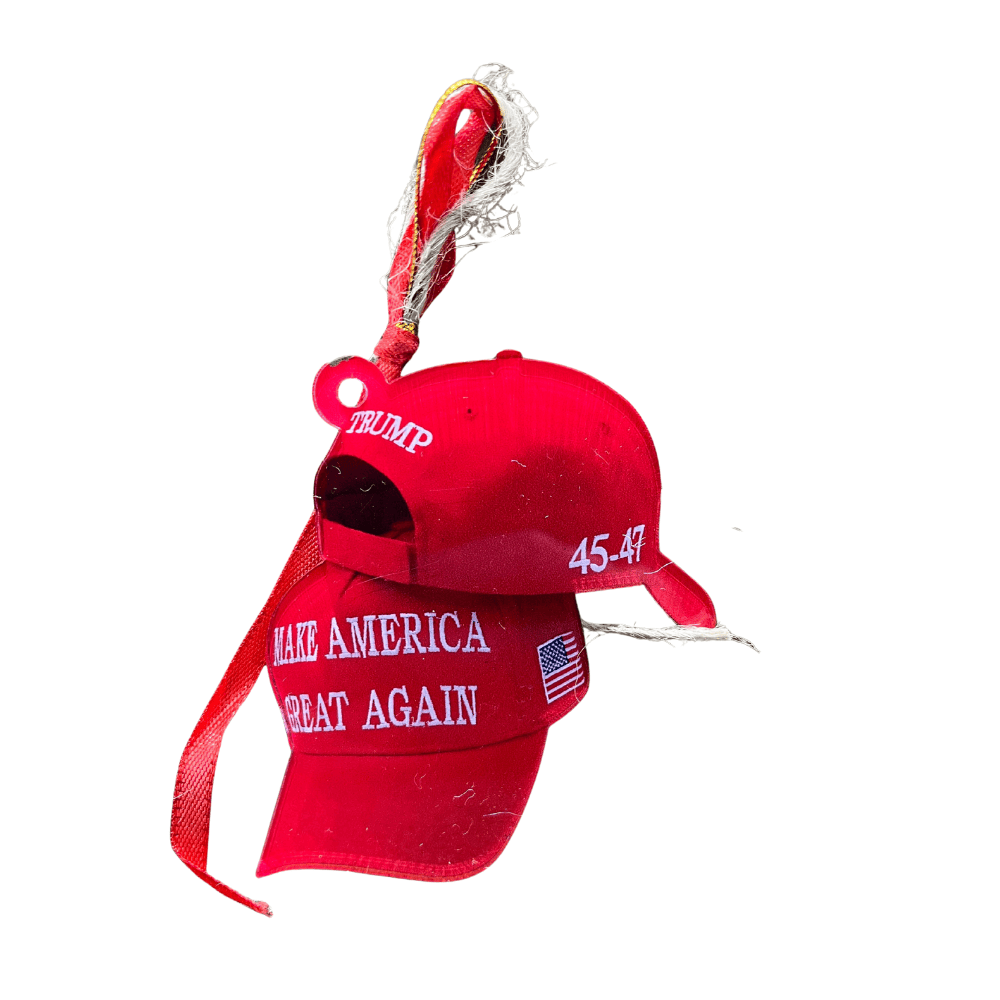 Red MAGA Hat Ornament featuring detailed embroidered-style 'Make America Great Again', American flag design, hanging on a festive Christmas tree.