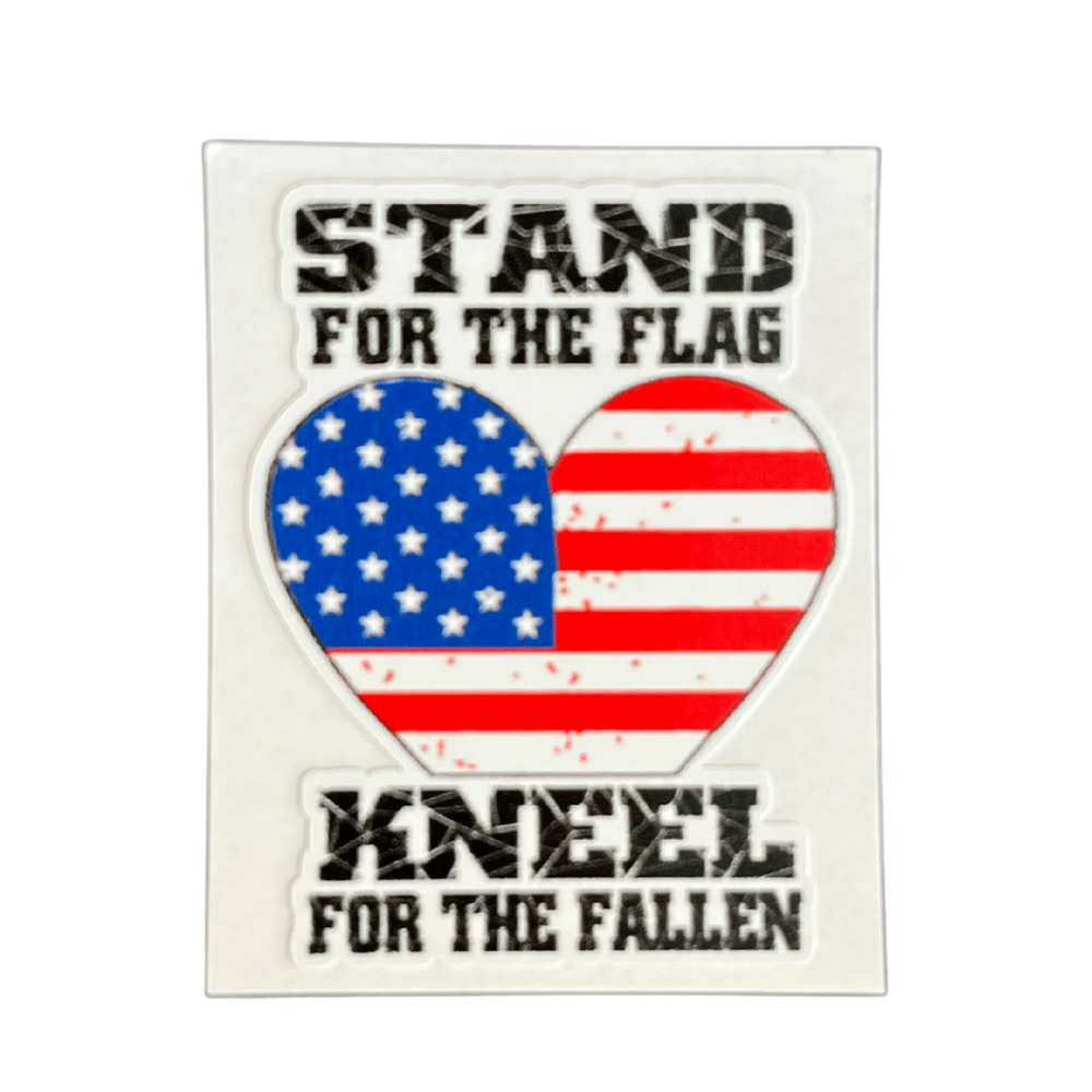 Stand For The Flag heart sticker displaying vibrant patriotic colors adhered to a laptop, showcasing American pride and political spirit.