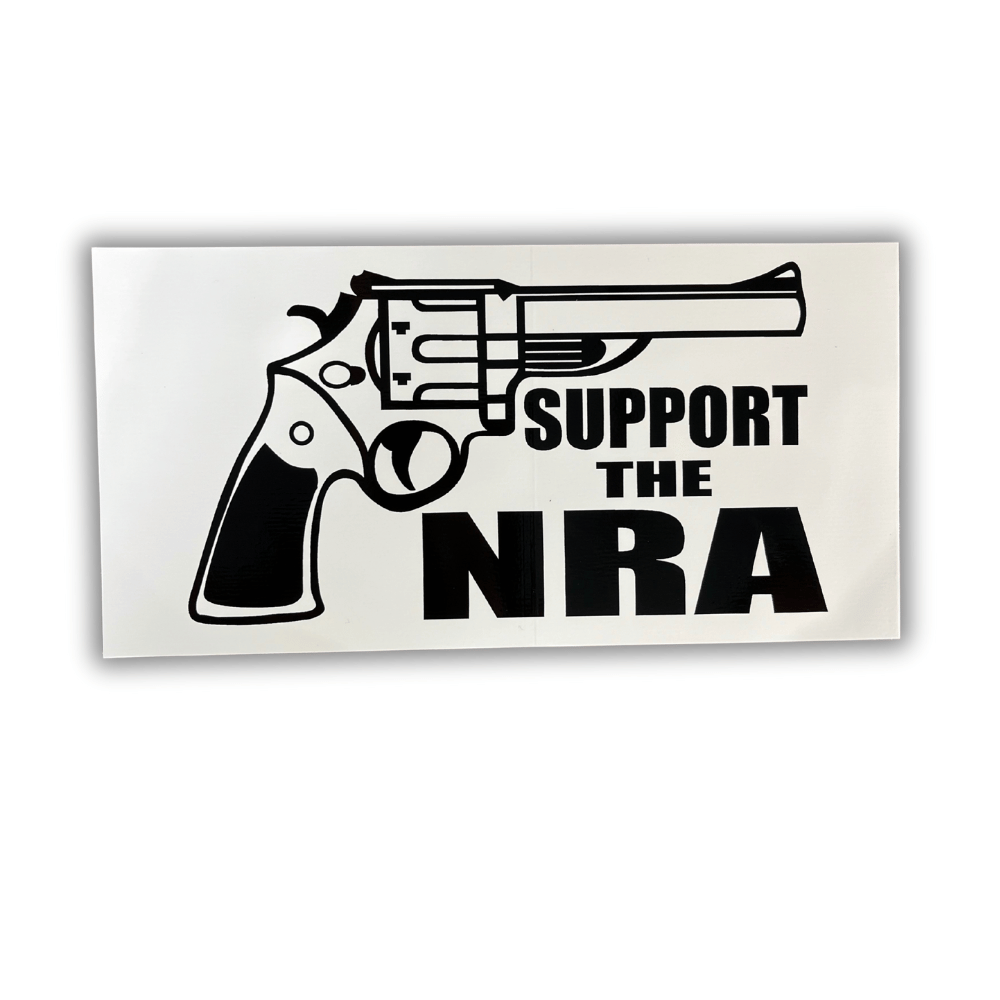 Support The NRA bumper sticker in bold colors, showcasing the Second Amendment message, applied on a vehicle bumper in an outdoor setting.