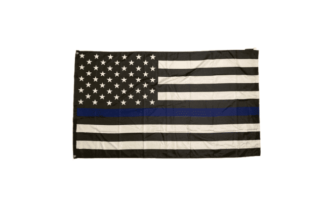 3x5 Thin Blue Line USA flag proudly displayed outdoors, featuring black and white colors with the blue line symbolizing law enforcement support.