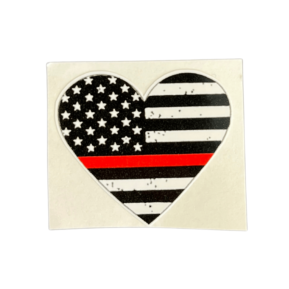 Thin Red Line Heart Sticker on a smooth surface showcasing a red line inside a heart, symbolizing support for first responders.