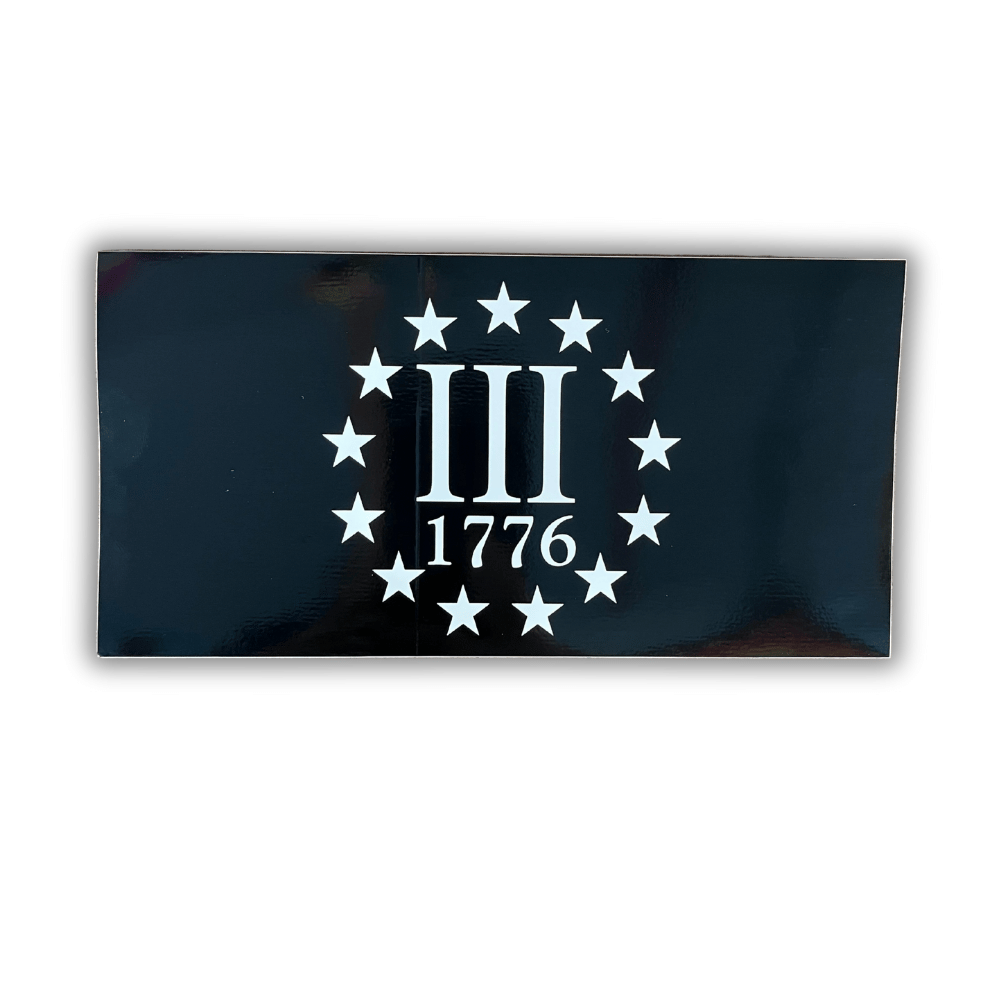 Three Percenters 1776 bumper sticker on a vehicle bumper, showcasing its bold patriotic design and dimensions of approximately 7.5 x 4 inches.