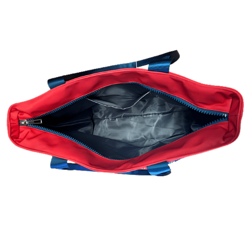 Trump 2024 Make America Great Again Lunch Bag in red and blue, featuring the slogan, displayed against a white background with side pocket.