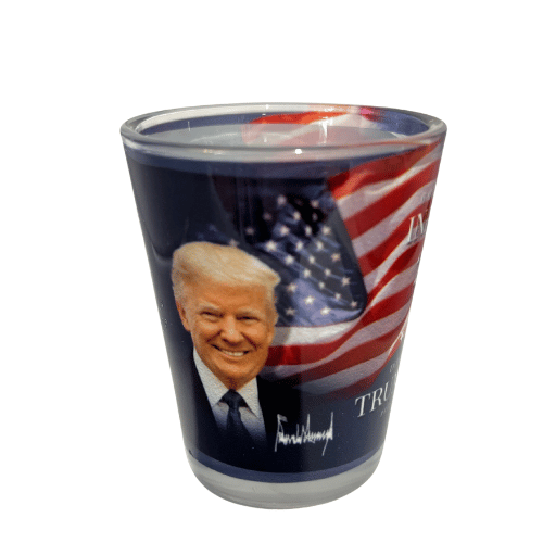 Trump 2025 Inauguration Shot Glass made of crystal-clear glass featuring U.S. Capitol and American flag backdrop with images of Trump and Vance.