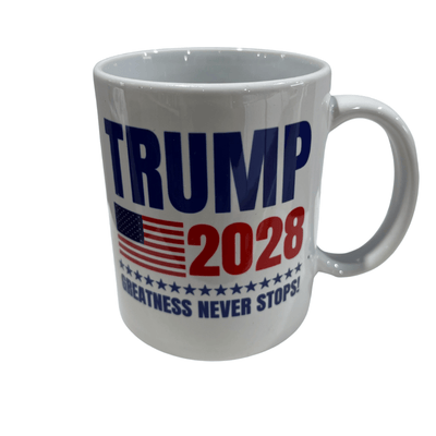 Trump 2028 Greatness Never Stops Mug featuring bold red and blue text with U.S. flag and stars, set against a kitchen backdrop.