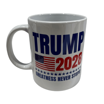 Trump 2028 Greatness Never Stops Mug featuring bold red and blue text with U.S. flag and stars, set against a kitchen backdrop.
