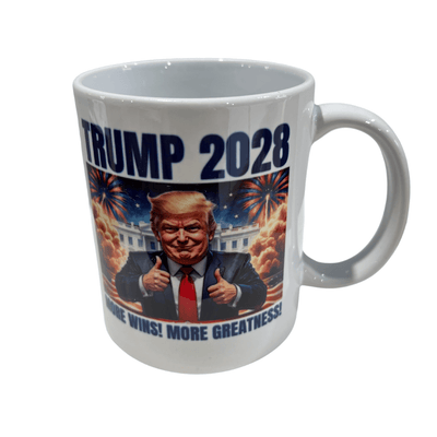 Trump 2028 More Wins ceramic mug featuring a cartoon Trump giving double thumbs-up in front of the White House and fireworks in a patriotic design.
