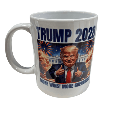 Trump 2028 More Wins ceramic mug featuring a cartoon Trump giving double thumbs-up in front of the White House and fireworks in a patriotic design.