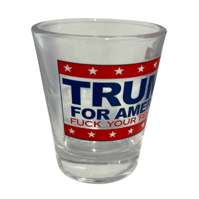 Trump F Your Feelings shot glass featuring a clear design, bold 'TRUMP FOR AMERICA' text, and 'F * YOUR FEELINGS' slogan against red and white stripes.
