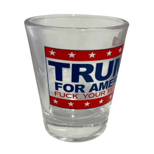 Trump F Your Feelings shot glass featuring a clear design, bold 'TRUMP FOR AMERICA' text, and 'F * YOUR FEELINGS' slogan against red and white stripes.
